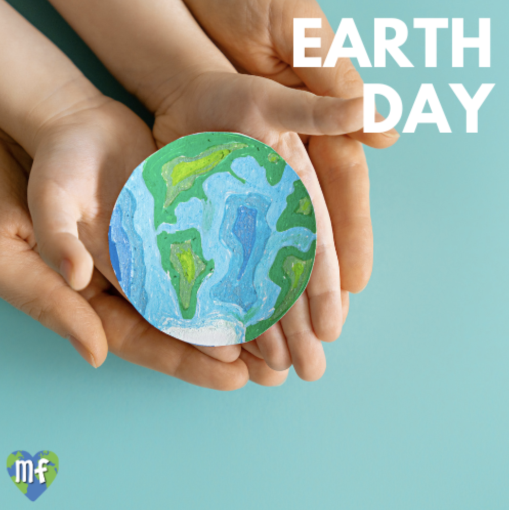 hands holding paper painting of earth