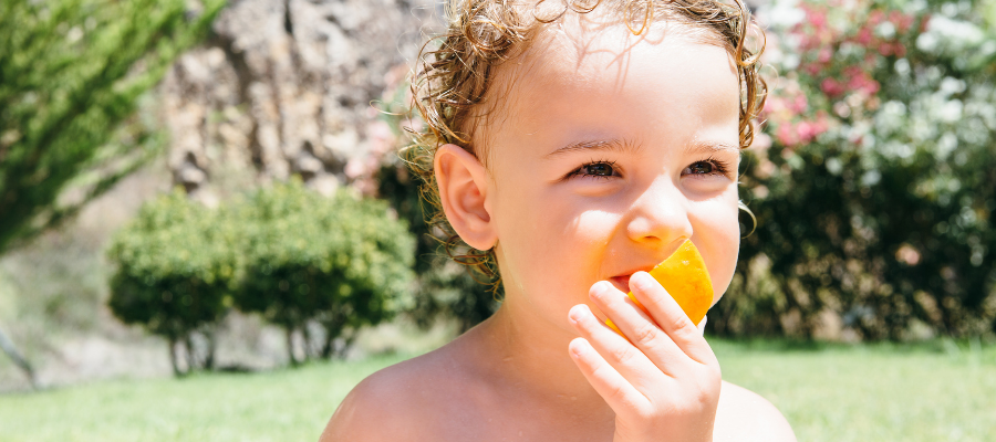 girl orange toddler girl eating orange