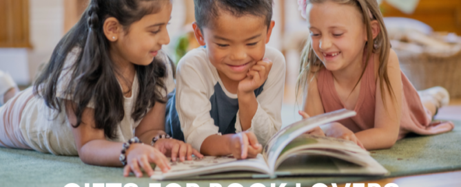 kids sitting on a blanket reading holiday books